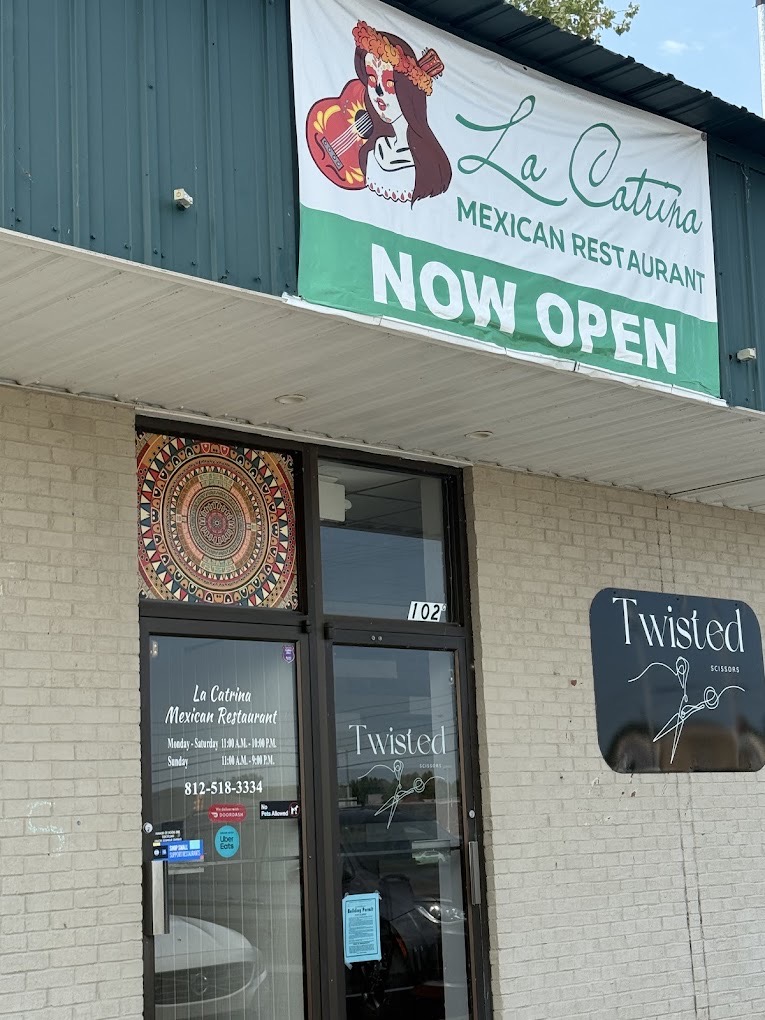 La Catrina's front door with posted hours, phone number, and DoorDash and Uber Eats stickers